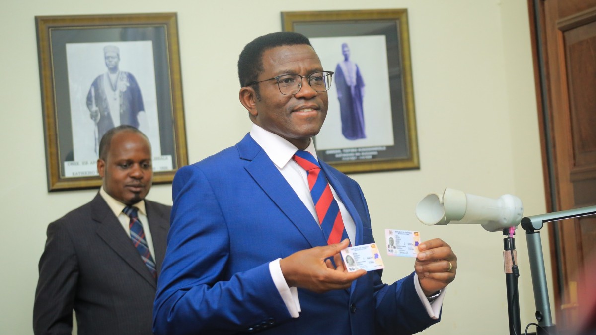 Katikkiro Charles Peter Mayiga (front) holding his national identity cards after officially receiving them at Bulange, Mengo. Katikkiro Charles Peter Mayiga (front) holding his national identity cards after officially receiving them at Bulange, Mengo.